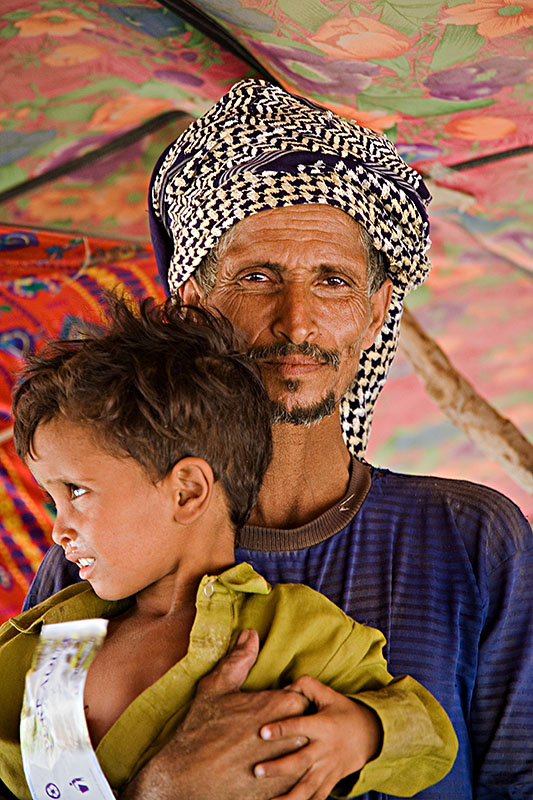57   Rashaida man with child